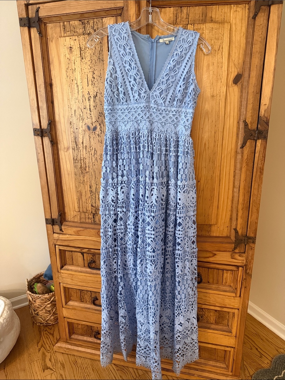 the clothing company Powder Blue Crochet V-Neck Maxi Dress